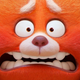 The poster of Pixar's Turning Red, showing the main character Mei Lee as a stressed red panda.